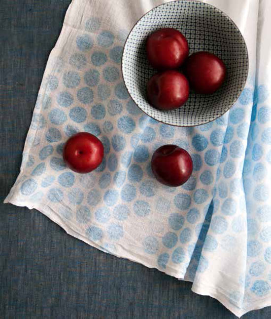 Soft circles and dots in primary colors add the perfect pattern to any cotton tea towel.